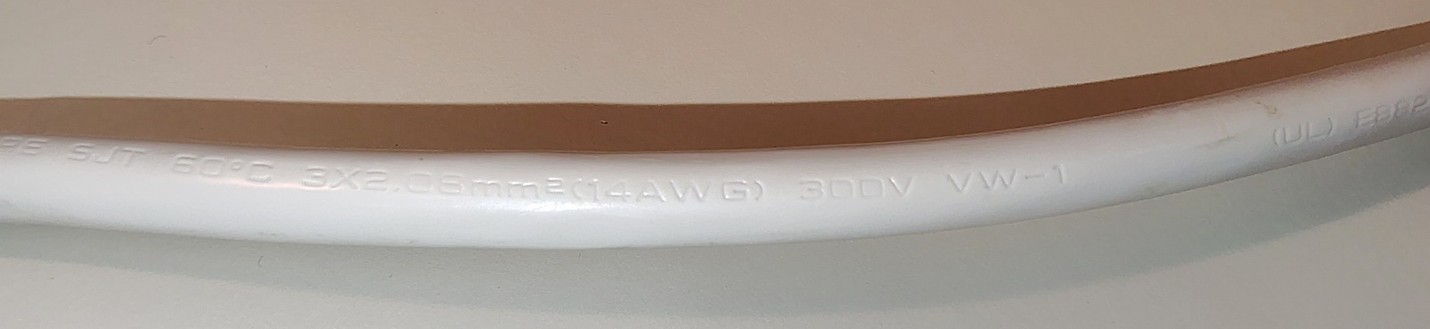 Cord jacket markings showing SJT construction, 14 AWG conductors, 300V rating, and VW-1 designation.