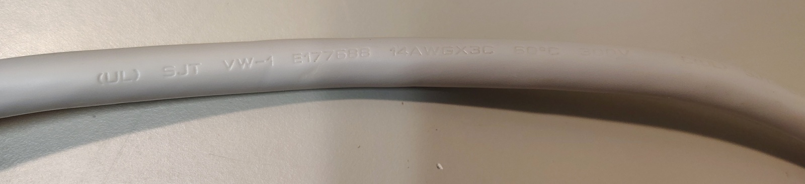 Power-cord markings showing UL file number, conductor size, and ratings.
