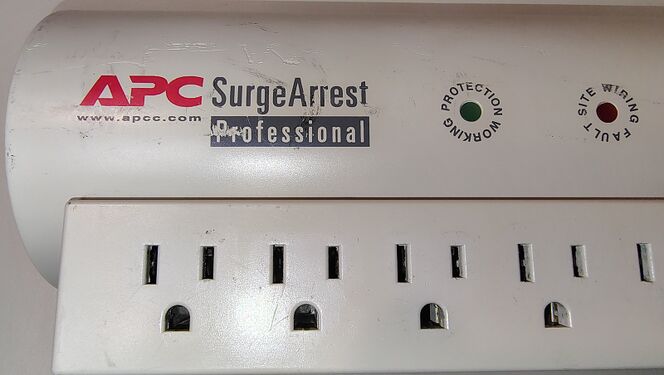 APC branding, status indicators, and cosmetic wear on the upper enclosure.
