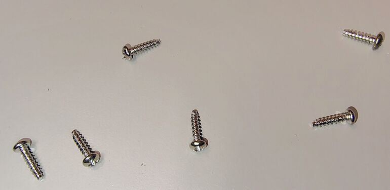 Enclosure screws removed during disassembly.