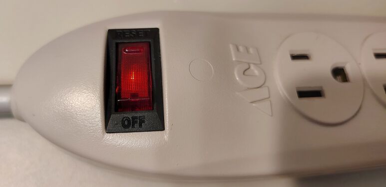 Close-up view of the illuminated rocker switch during operation.
