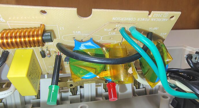 Suppression circuitry showing the ©2002 APC board revision, filtering components, wiring, and indicator assemblies.