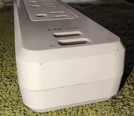 USB charging ports and transformer-spaced outlet.