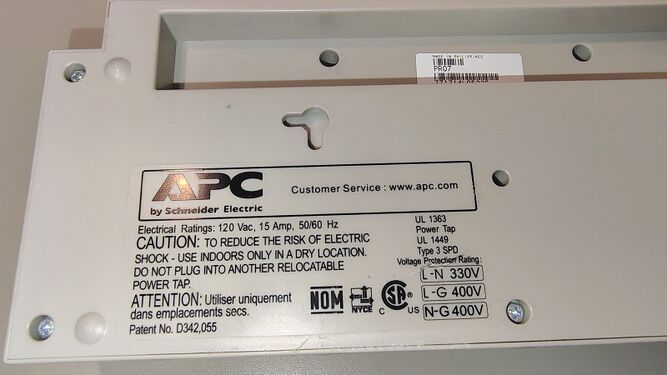 Product information label showing electrical ratings and voltage protection ratings.