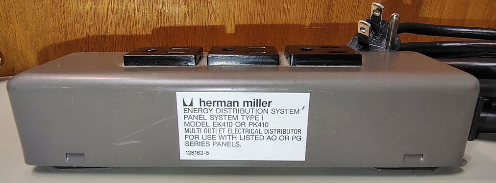 Herman Miller identification label showing Energy Distribution System compatibility with Panel System Type I installations and AO or PG series panels.