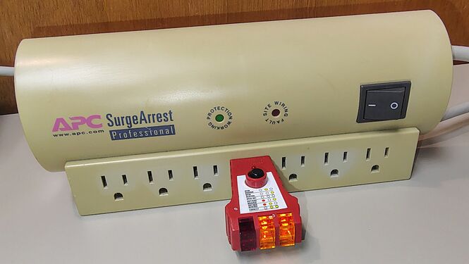Outlet tester indicating correct wiring and grounding.