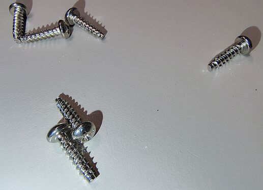 Enclosure screws removed during disassembly.