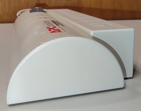 Outlet-end profile showing the curved enclosure section and overall housing design.