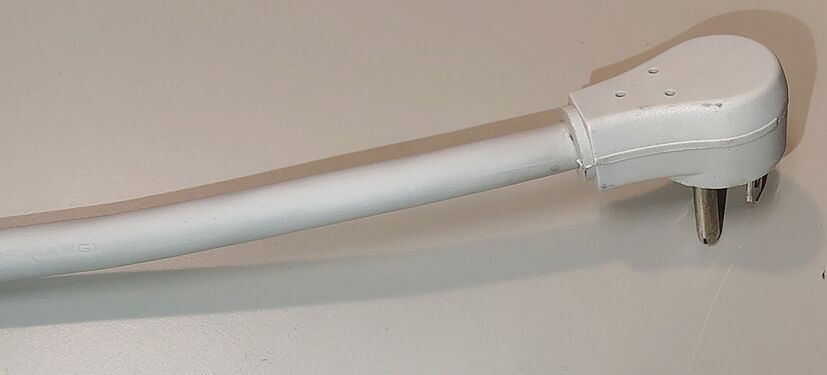 Right-angle plug and attached power cord.