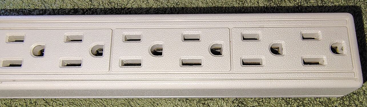 Six grounded outlets arranged in three molded outlet pairs.