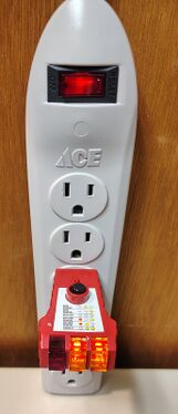 Outlet tester indicating correct wiring and grounding.