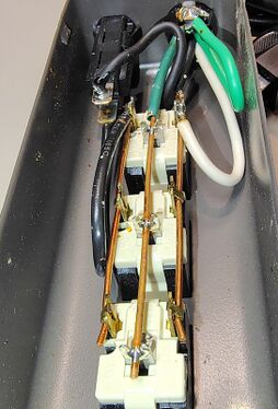 Internal wiring showing solid copper distribution conductors and receptacle assembly.