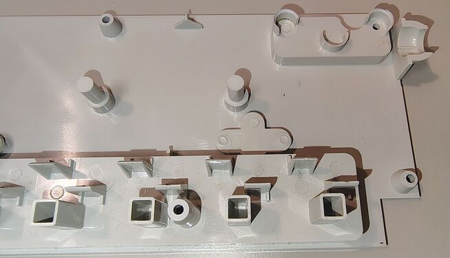 Upper-housing details and molded outlet barriers.