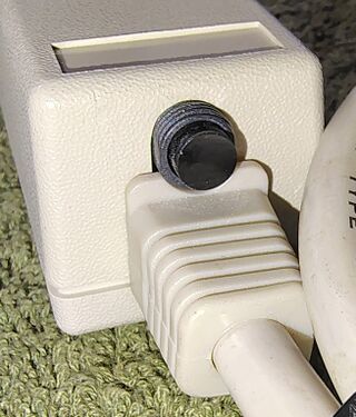 Cord-entry end showing the resettable circuit breaker and strain-relief assembly.
