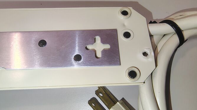 Mounting plate detail near the cord entry.