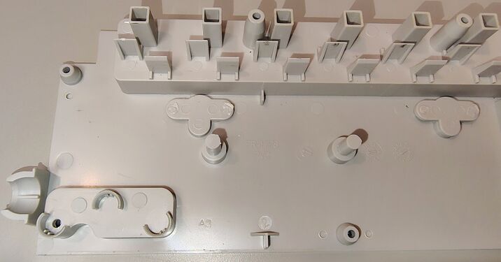 Interior of the upper housing showing outlet barriers and mounting provisions.
