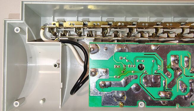 Outlet-contact assemblies, bus bars, and underside of the suppression circuit board.