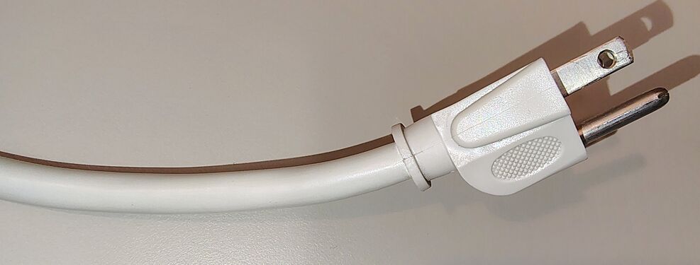 Grounded plug and attached power cord.