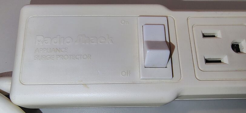 Radio Shack branding and illuminated rocker-switch section.