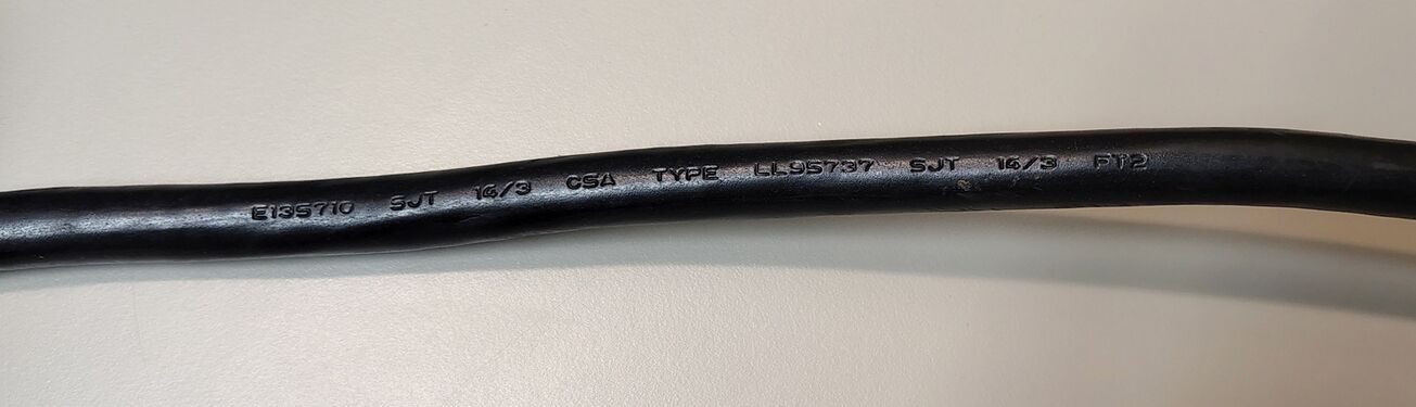 Cord markings showing SJT 16/3 construction and approval markings.