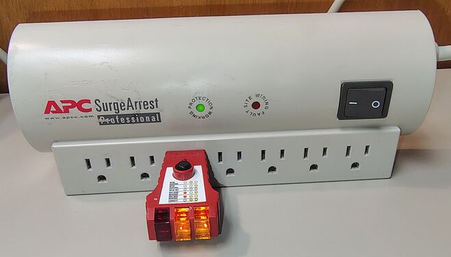 Outlet tester indicating correct wiring and grounding.