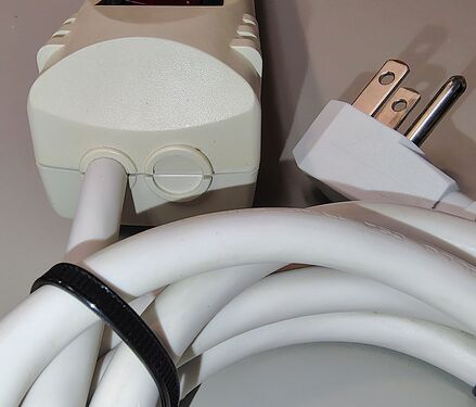 Cord-entry end showing the strain relief and unused molded knockout.