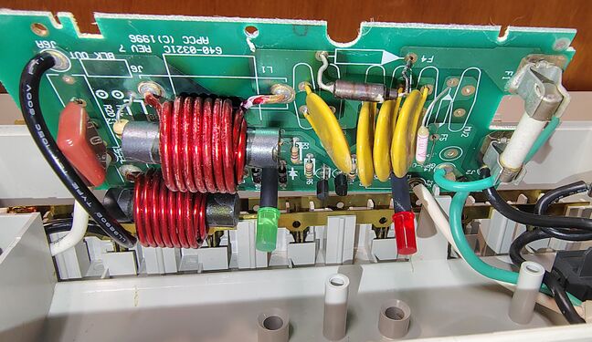 Suppression circuitry showing MOVs, filtering components, status-indicator circuitry, and ©1996 APC circuit-board markings.