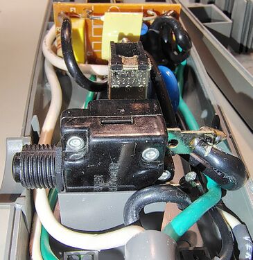 Push-button switch assembly and surge-suppression components.