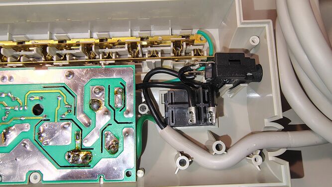Cord-entry wiring, switch, and breaker assembly.