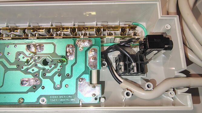 Cord-entry area showing power-switch assembly and internal wiring.