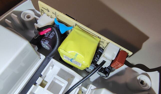 USB charging power-supply section showing the transformer, capacitors, and charging circuitry.