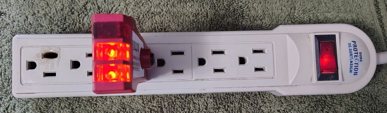 Outlet tester indicating correct wiring and grounding.