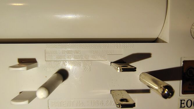 Model, item number, electrical ratings, and surge-protection markings.