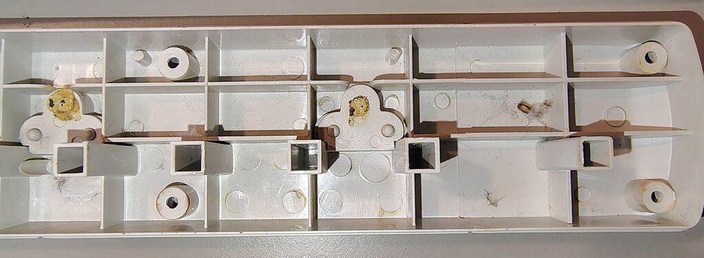 Upper housing details at the transformer-outlet end.