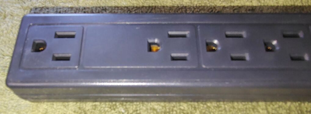 Widened outlet spacing for transformer-style adapters.