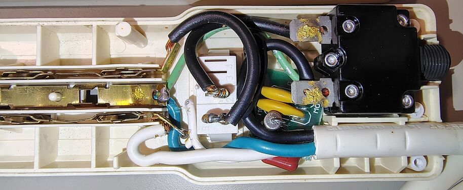 Switch-end interior showing the rocker switch, circuit breaker, and power-cord wiring.