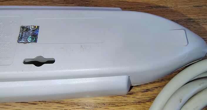 Power-cord entry end and certification markings.