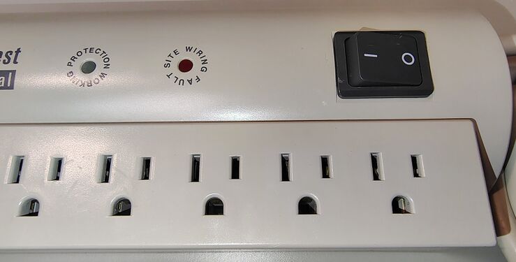 Protection Working indicator, Site Wiring Fault indicator, and rocker-switch assembly.