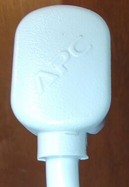 Rear of the attachment plug showing molded APC branding.