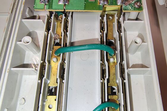 Stamped brass outlet bus bars and power distribution jumpers.