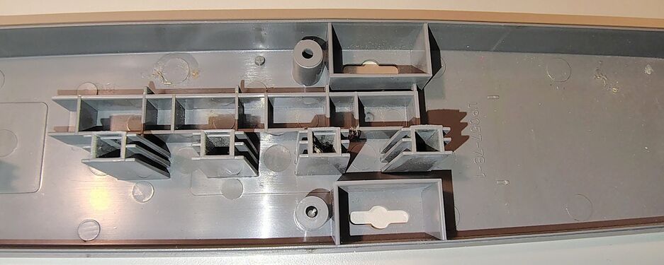 Upper enclosure showing outlet barriers and structural reinforcement features.