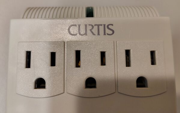 Curtis branding and upper outlet row detail.