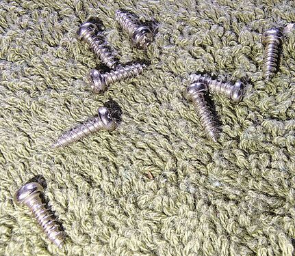 Enclosure screws removed during disassembly.