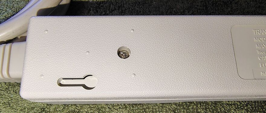 Cord-entry area showing the resettable circuit breaker and strain-relief assembly.