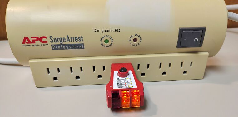 Outlet tester indicating correct wiring and grounding.
