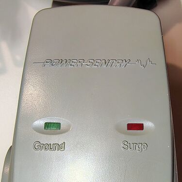PowerSentry branding together with Ground and Surge status indicators.