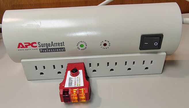 Outlet tester indicating correct wiring and grounding.