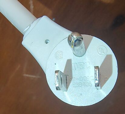 Right-angle attachment plug with approval markings.