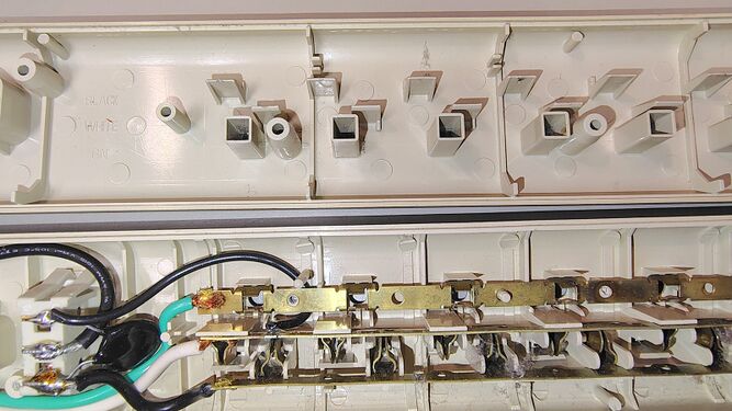 Interior construction showing outlet assemblies and brass bus bars.