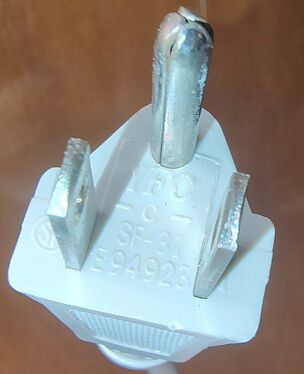 Detail view of the unbranded NEMA 5-15P attachment plug.